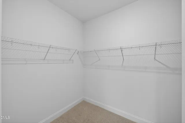 an empty room with a empty space and window