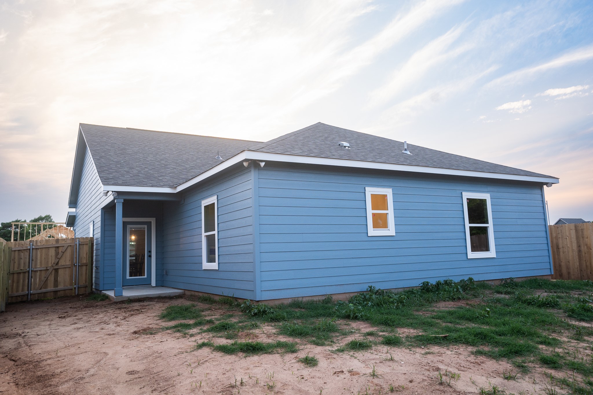 306 String Prairie Way Smithville, TX 78957 - Photo 23 of 25 View of home's exterior with roof with shingles