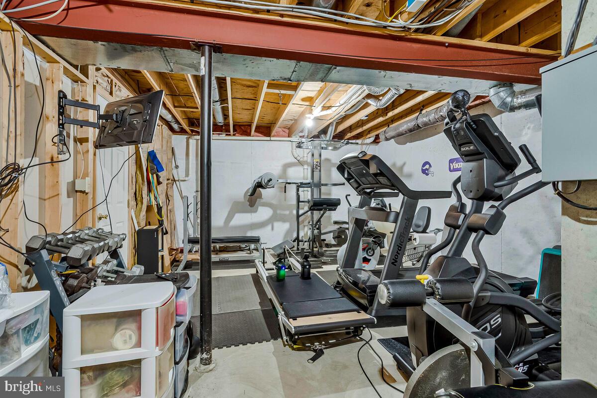 3897 Hunting Creek Road Huntingtown, MD 20639 - Photo 50 of 75 a view of a room with gym equipment