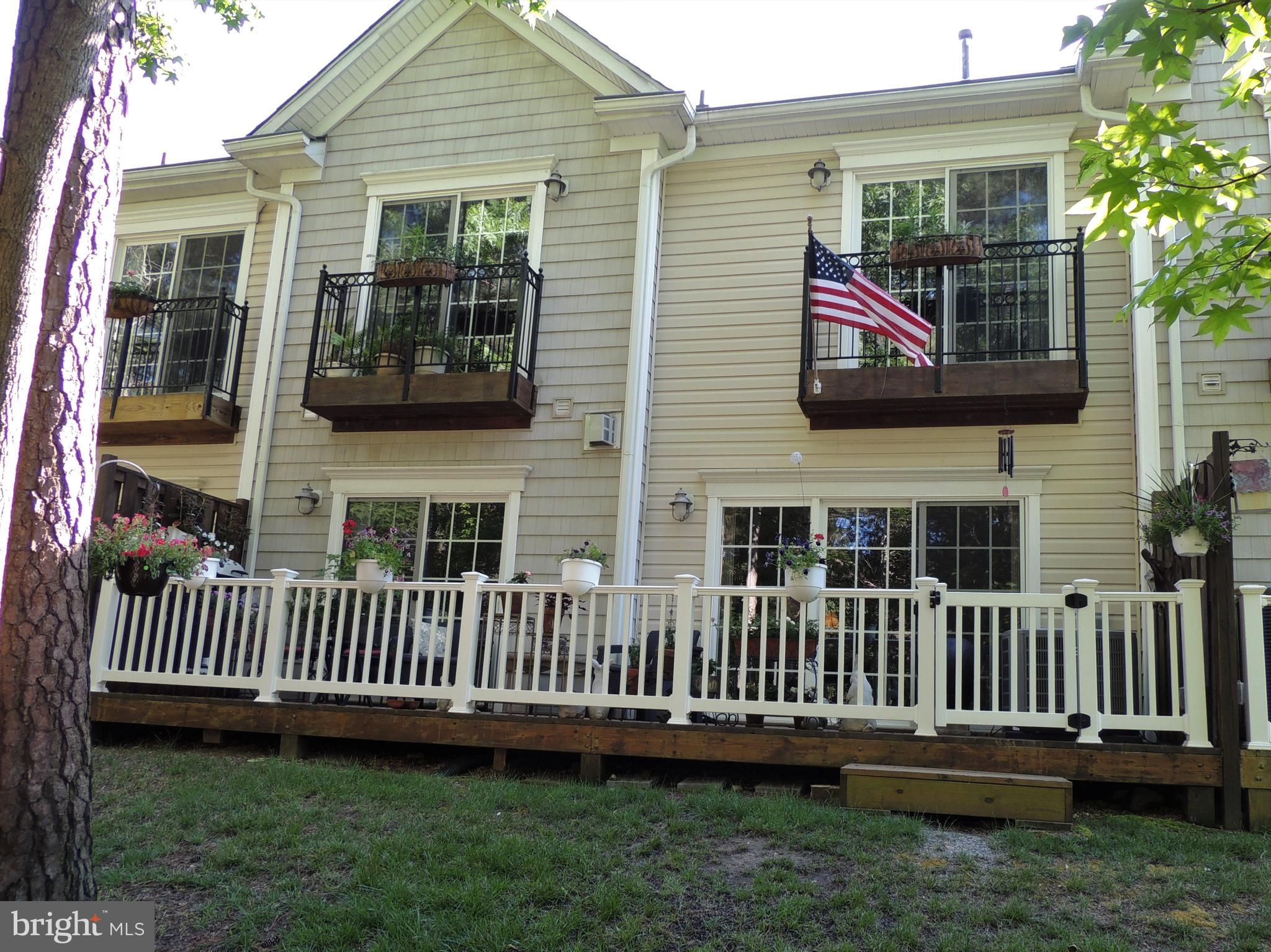 14174 Foxhall Road, Unit 12 Dowell, MD 20629 - Photo 29 of 40 Deck and Juliet balconies overlook the water