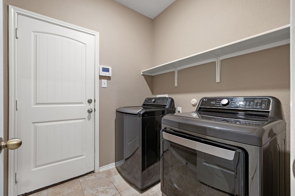 1012 Plano Lane Leander, TX 78641 - Photo 19 of 21 a view of storage and utility room with washer and dryer