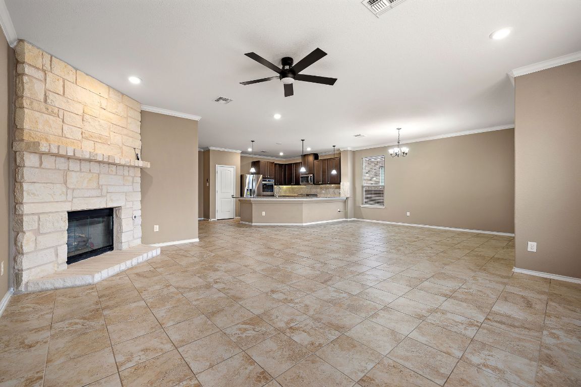 1012 Plano Lane Leander, TX 78641 - Photo 8 of 21 a view of a livingroom with a fireplace and window