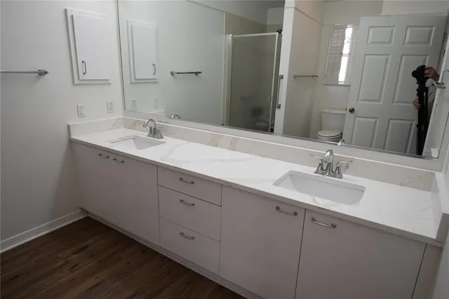 a view of a big house with a big yard and palm trees