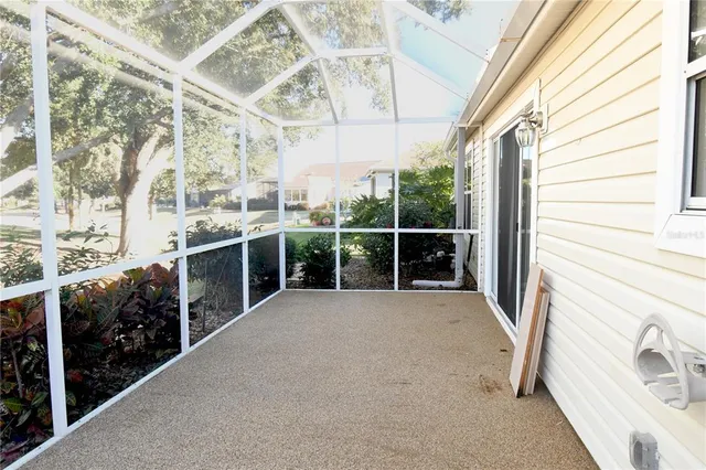 a view of swimming pool with trees and sitting space