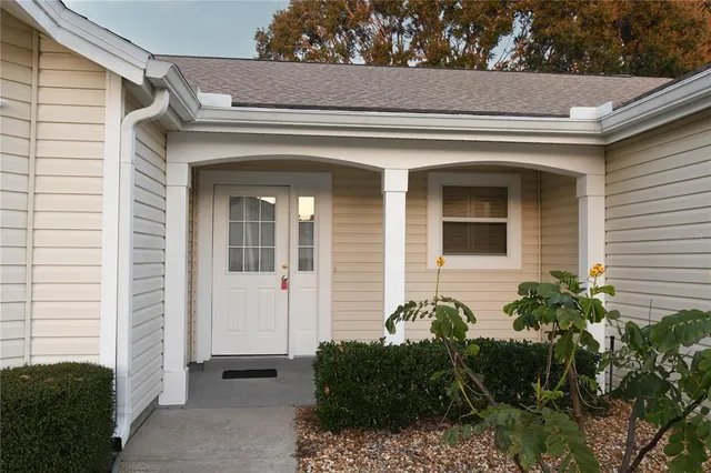 a kitchen with stainless steel appliances a refrigerator and a stove top oven
