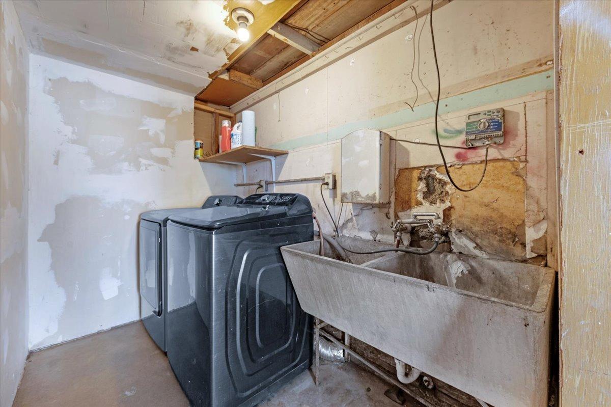 4185 East Turner Avenue Fresno, CA 93702 - Photo 21 of 39 a kitchen with sink a washer and dryer