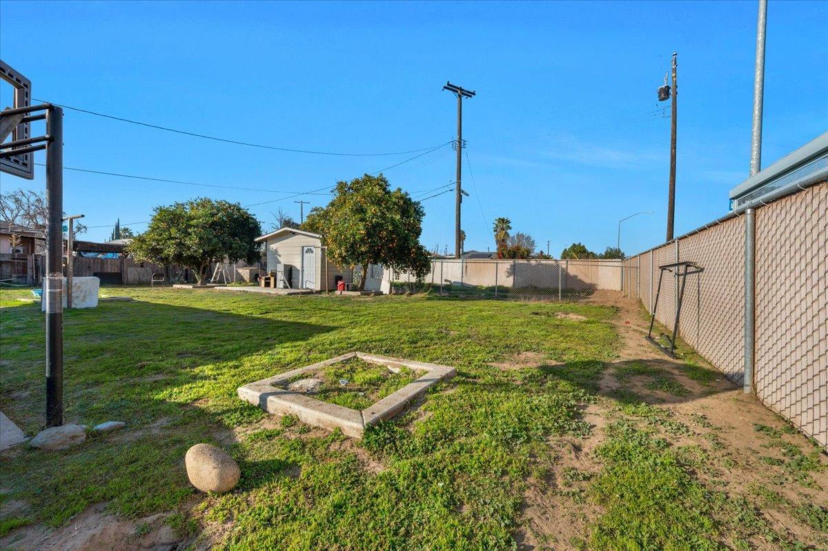 4185 East Turner Avenue Fresno, CA 93702 - Photo 23 of 39 a backyard of a house with table and chairs