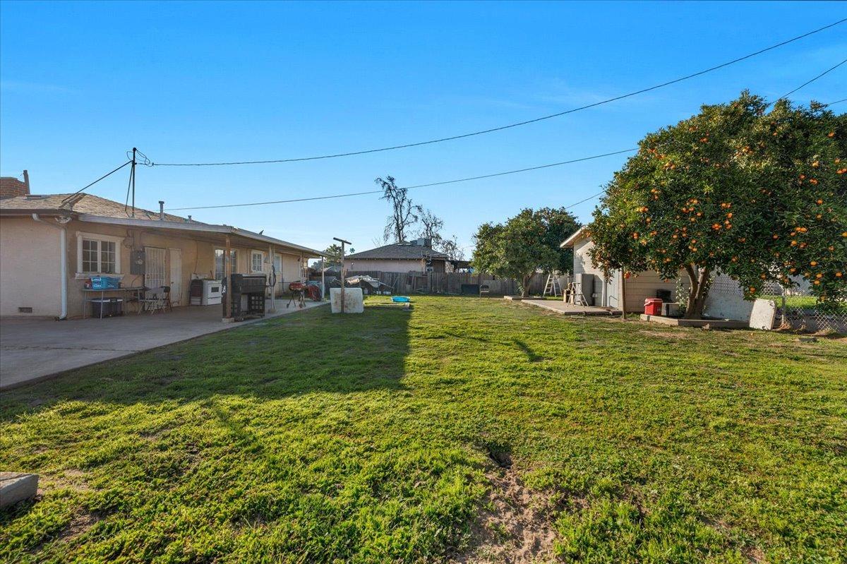 4185 East Turner Avenue Fresno, CA 93702 - Photo 24 of 39 a front view of a house with garden