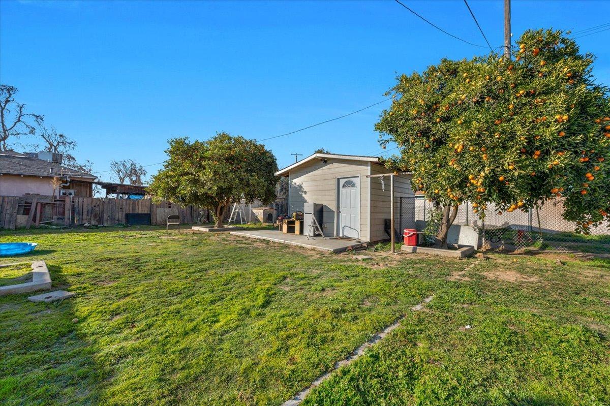 4185 East Turner Avenue Fresno, CA 93702 - Photo 27 of 39 a view of a house with a yard and sitting area