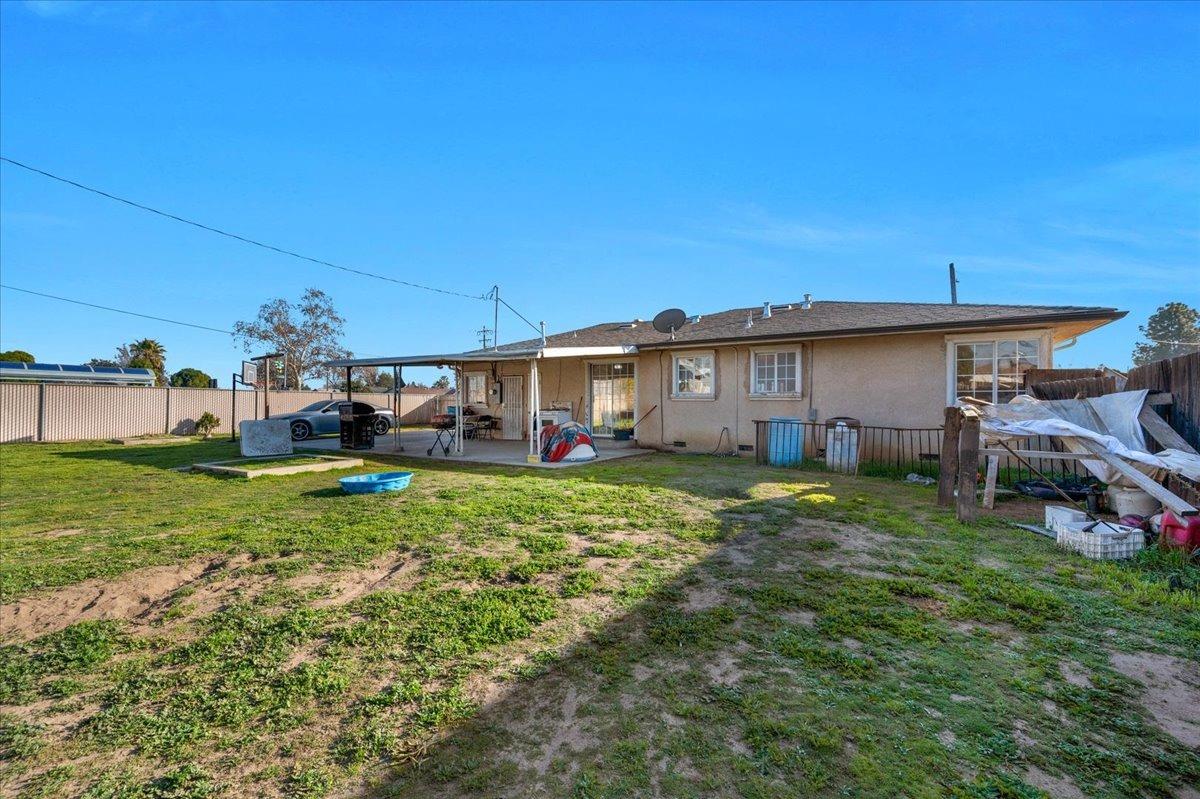 4185 East Turner Avenue Fresno, CA 93702 - Photo 29 of 39 a view of a house with backyard and porch