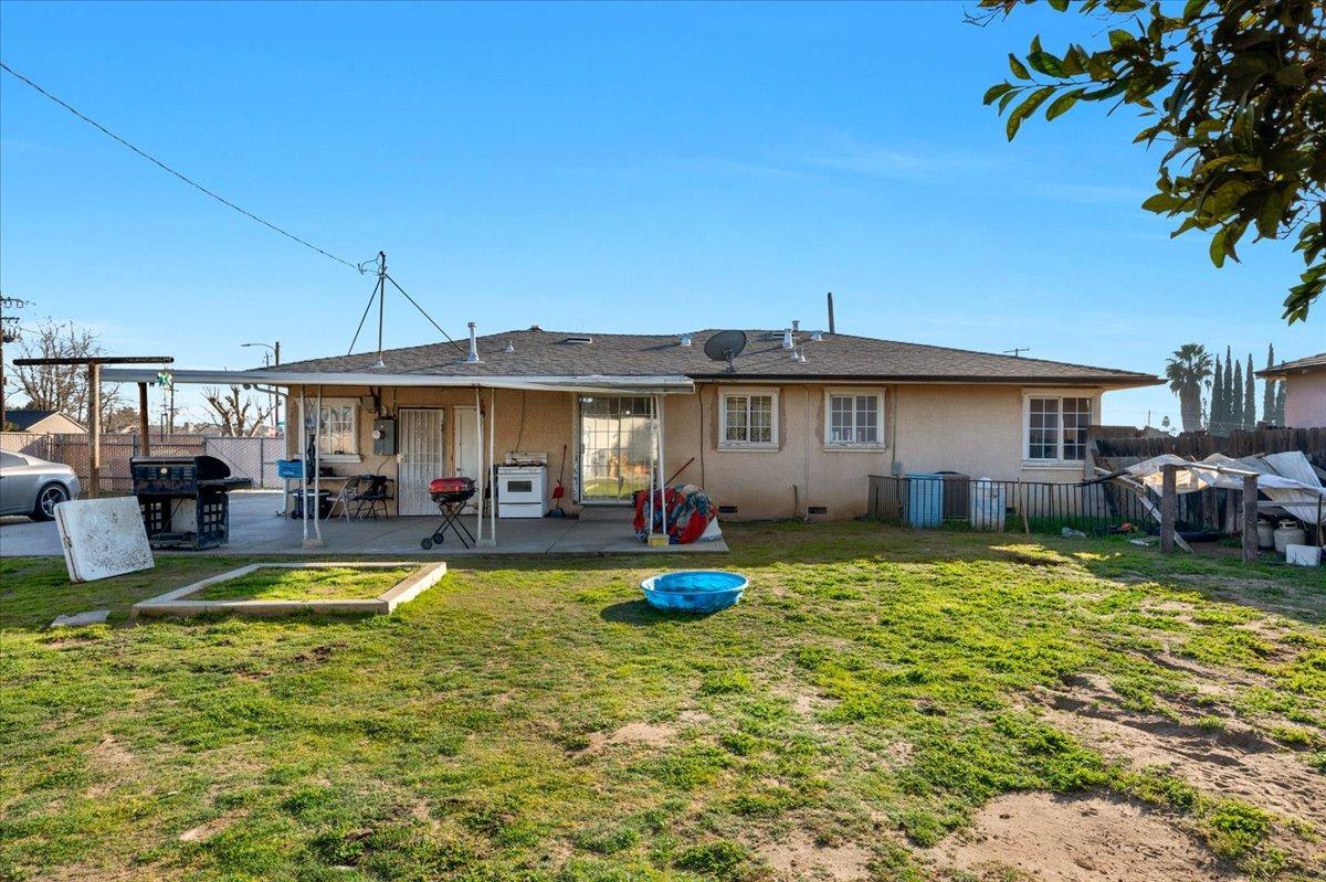 4185 East Turner Avenue Fresno, CA 93702 - Photo 31 of 39 a view of a house with swimming pool and sitting area
