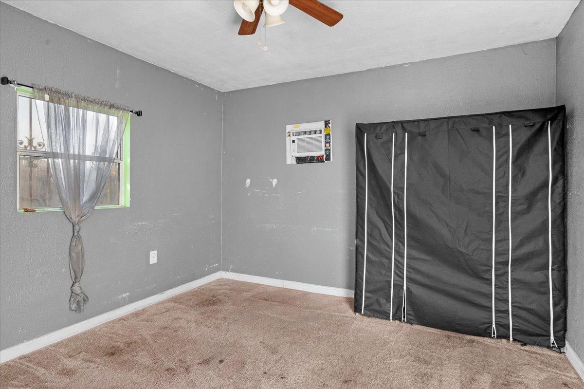 4185 East Turner Avenue Fresno, CA 93702 - Photo 33 of 39 a view of an empty room with a window