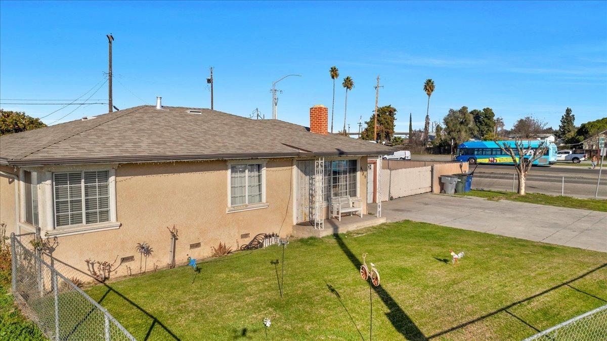 4185 East Turner Avenue Fresno, CA 93702 - Photo 4 of 39 a view of a house with pool backyard and sitting area