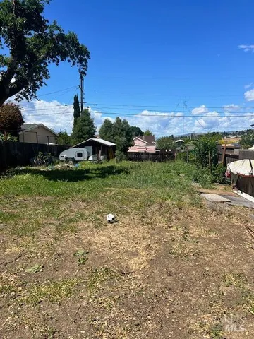 a view of a garden with houses