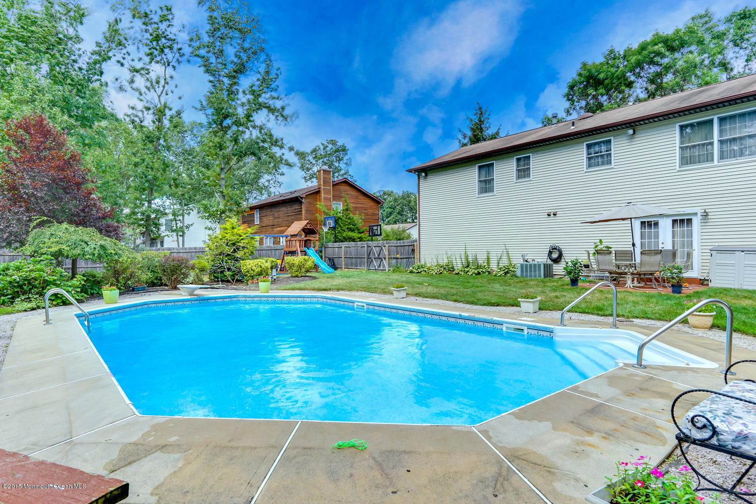6 Hickory Hill Road Jackson, NJ 08527 - Photo 2 of 53 a view of swimming pool with lawn chairs and plants