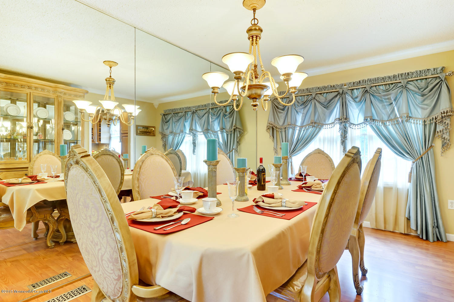 6 Hickory Hill Road Jackson, NJ 08527 - Photo 18 of 53 a dining room with wooden floor a chandelier a wooden table and chairs