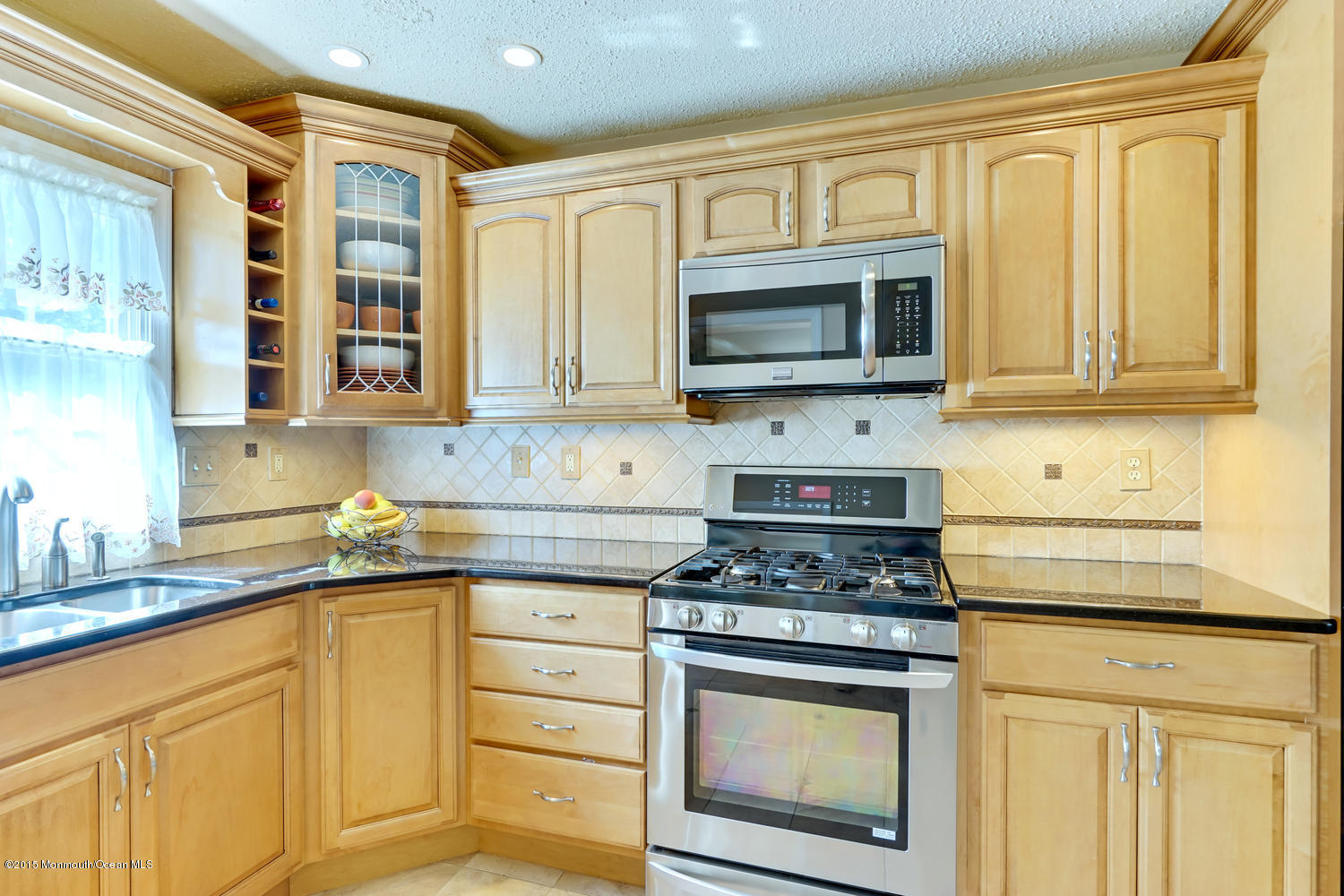 6 Hickory Hill Road Jackson, NJ 08527 - Photo 21 of 53 a kitchen with stainless steel appliances granite countertop cabinets and a stove top oven