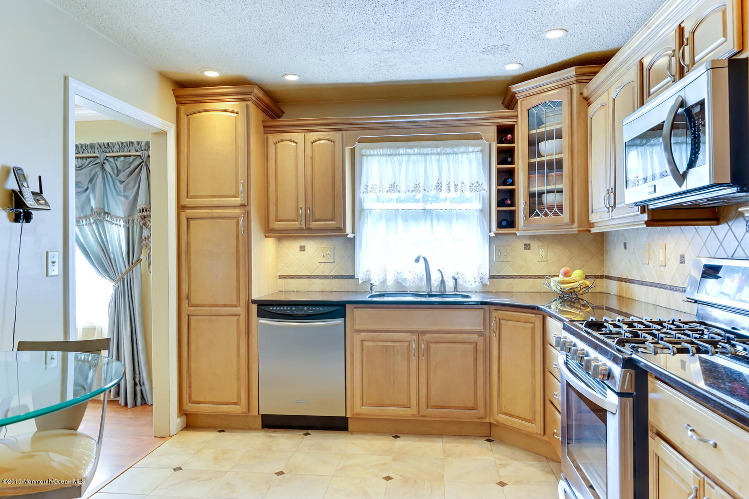 6 Hickory Hill Road Jackson, NJ 08527 - Photo 27 of 53 a kitchen with stainless steel appliances granite countertop a sink and a stove