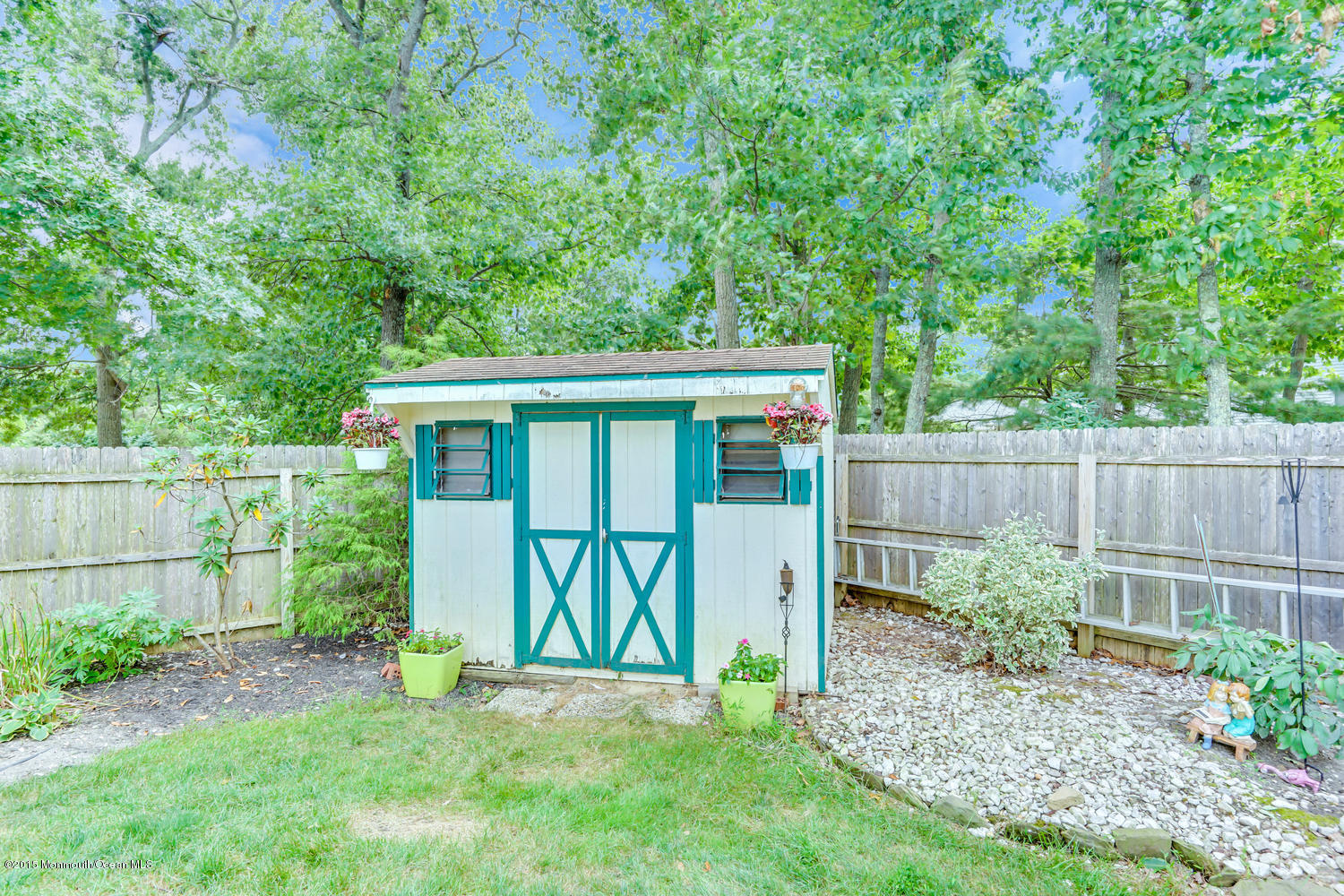 6 Hickory Hill Road Jackson, NJ 08527 - Photo 51 of 53 a view of a backyard with a small cabin and a chair