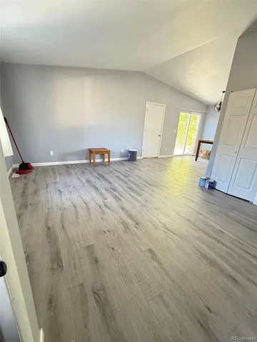a view of a livingroom with wooden floor