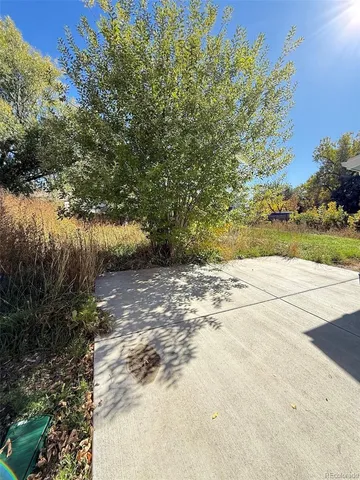 a backyard of a house with lots of green space