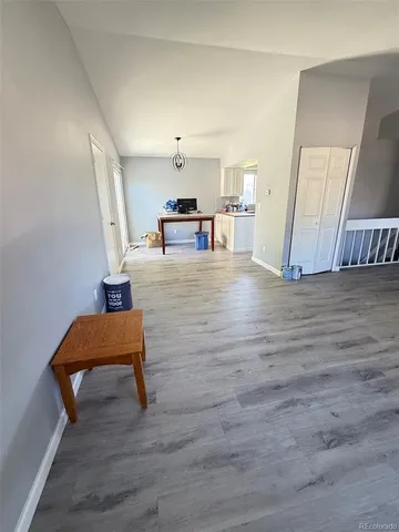 a living room with furniture and a chair