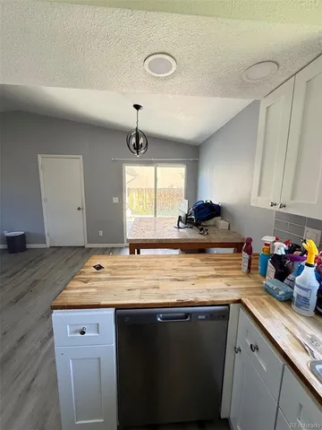 a kitchen with a sink cabinets and window
