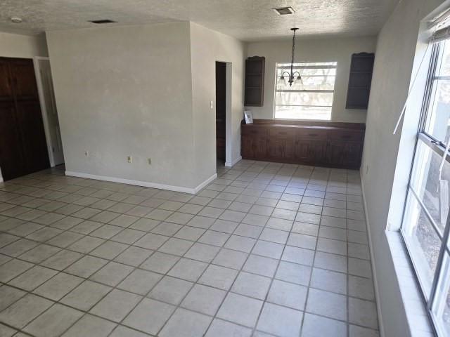 217 Griffith Drive Rockport, TX 78382 - Photo 6 of 14 an empty room with windows and entrance