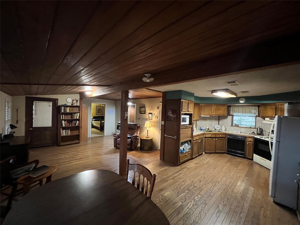 419 Limestone County Road 648, Unit LCR Thornton, TX 76687 - Photo 13 of 20 a large open kitchen with a large window a counter space stainless steel appliances and cabinets