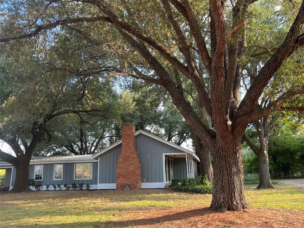 419 Limestone County Road 648, Unit LCR Thornton, TX 76687 - Photo 3 of 20 a view of a house with a large tree in front of a house