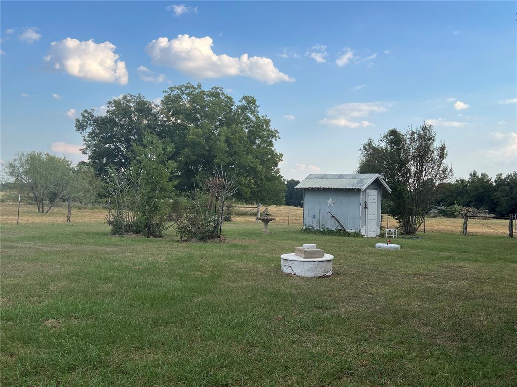 419 Limestone County Road 648, Unit LCR Thornton, TX 76687 - Photo 8 of 20 a view of a tiny house with a backyard