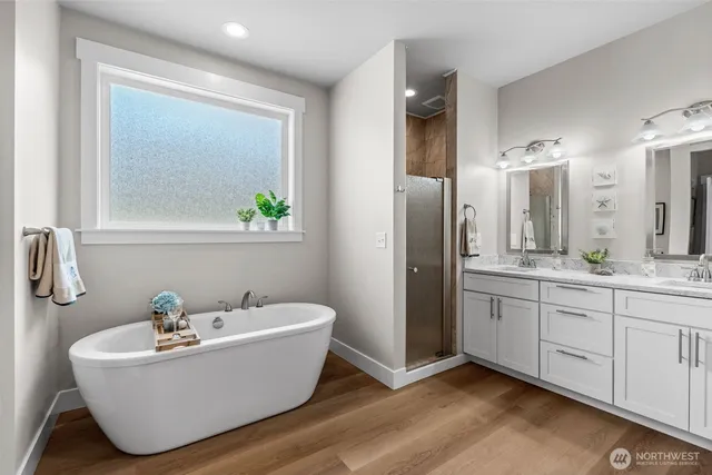 a bathroom with a bathtub and a sink
