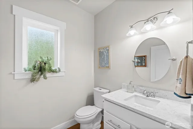 a view of white cabinets and sink