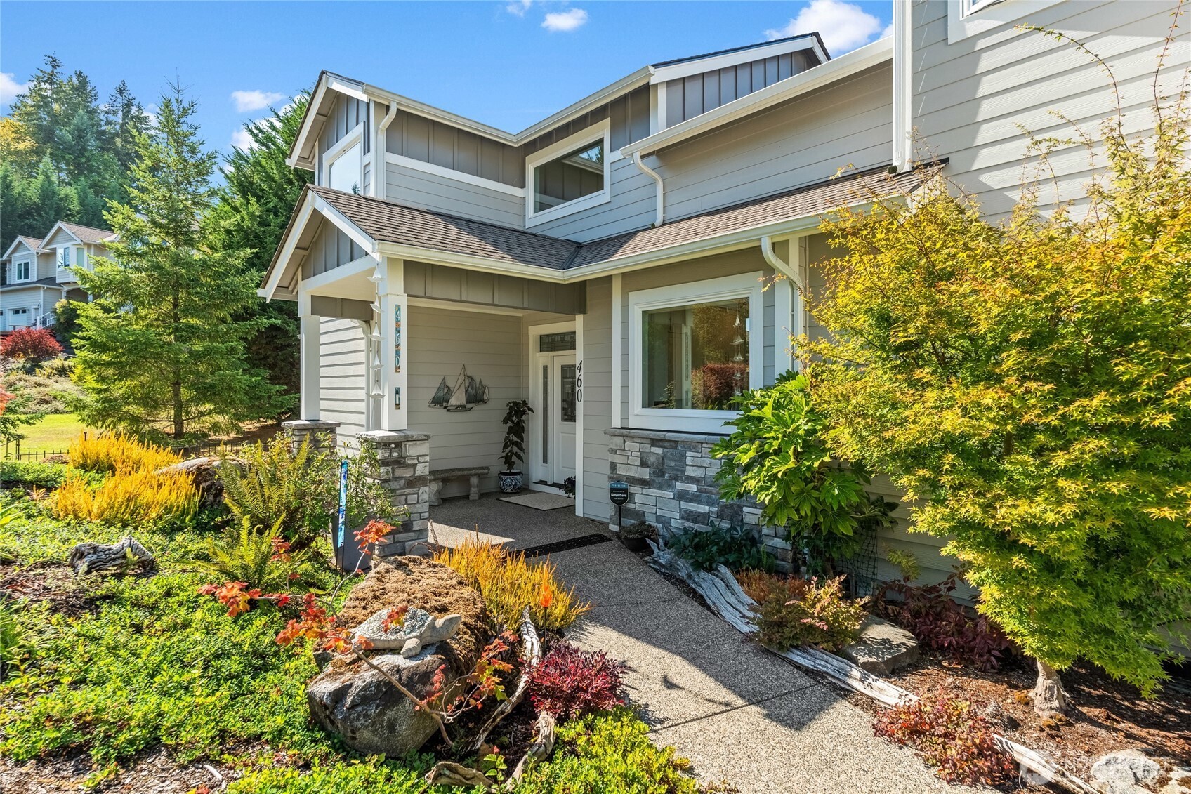 460 East Stretch Island Road South Grapeview, WA 98546 - Photo 2 of 39 a view of a chair and tables in the patio