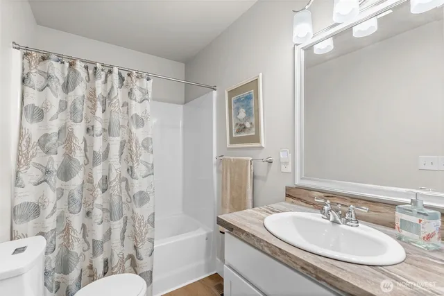 a kitchen with granite countertop a stove and a sink