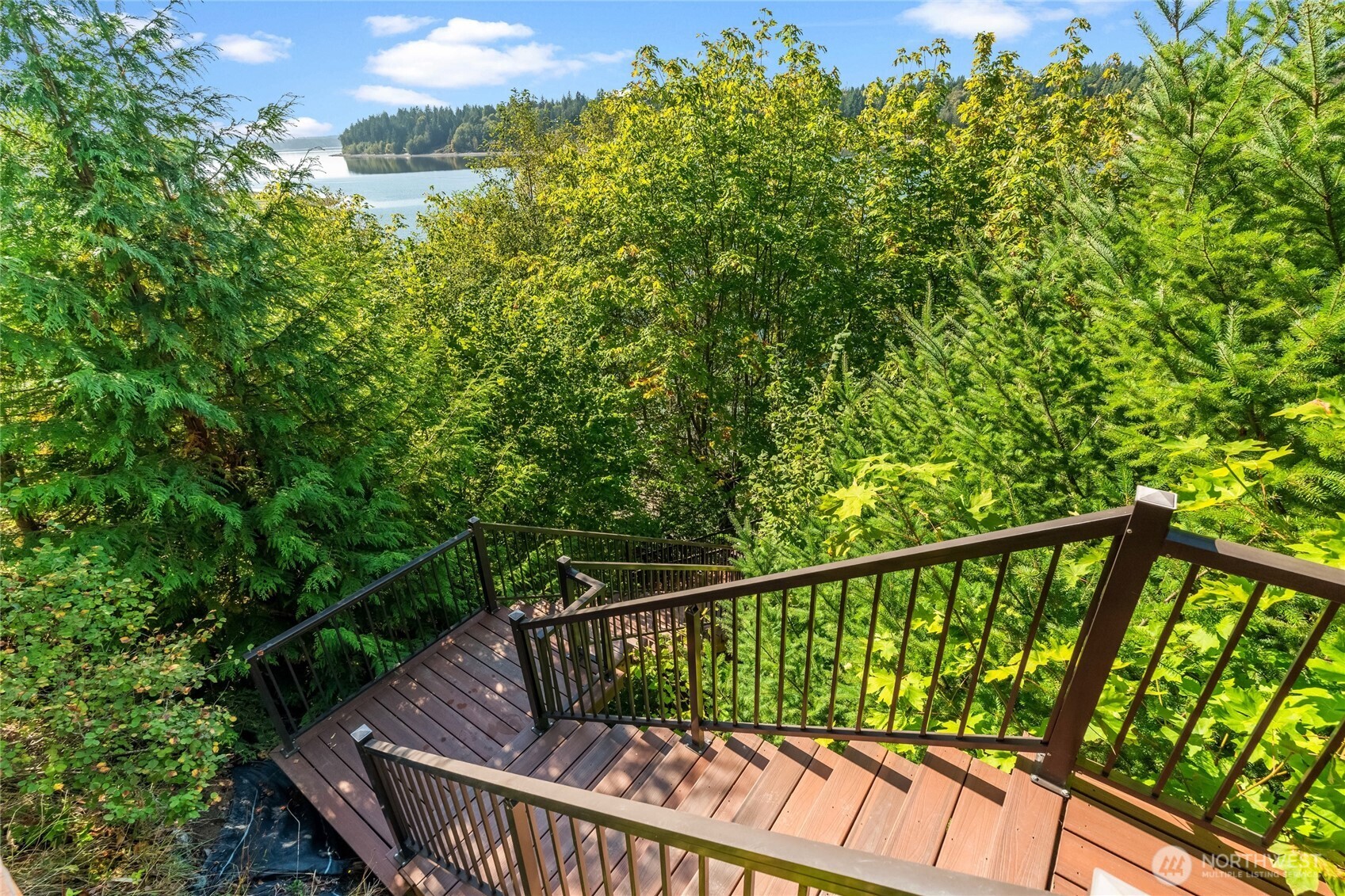 460 East Stretch Island Road South Grapeview, WA 98546 - Photo 31 of 39 a view of balcony with deck and outdoor seating