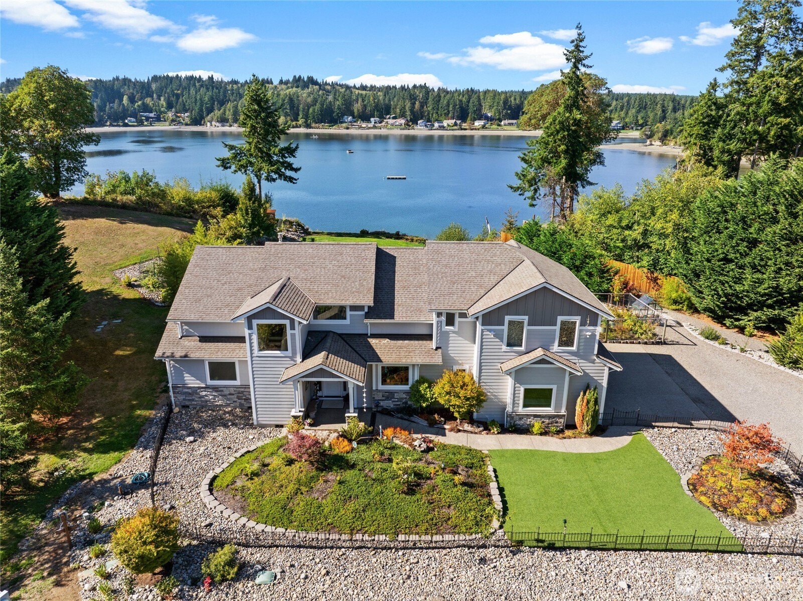 460 East Stretch Island Road South Grapeview, WA 98546 - Photo 38 of 39 an aerial view of house with yard swimming pool and lake view