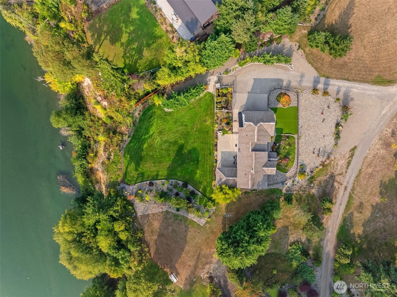 460 East Stretch Island Road South Grapeview, WA 98546 - Photo 39 of 39 an aerial view of a house with a yard