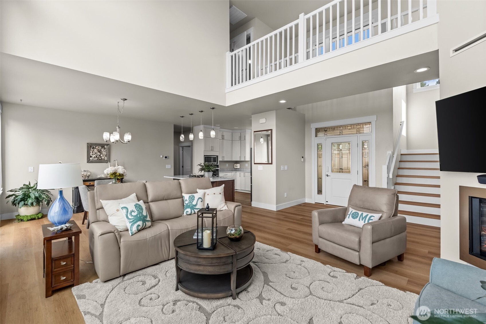 460 East Stretch Island Road South Grapeview, WA 98546 - Photo 7 of 39 a living room with furniture and a wooden floor