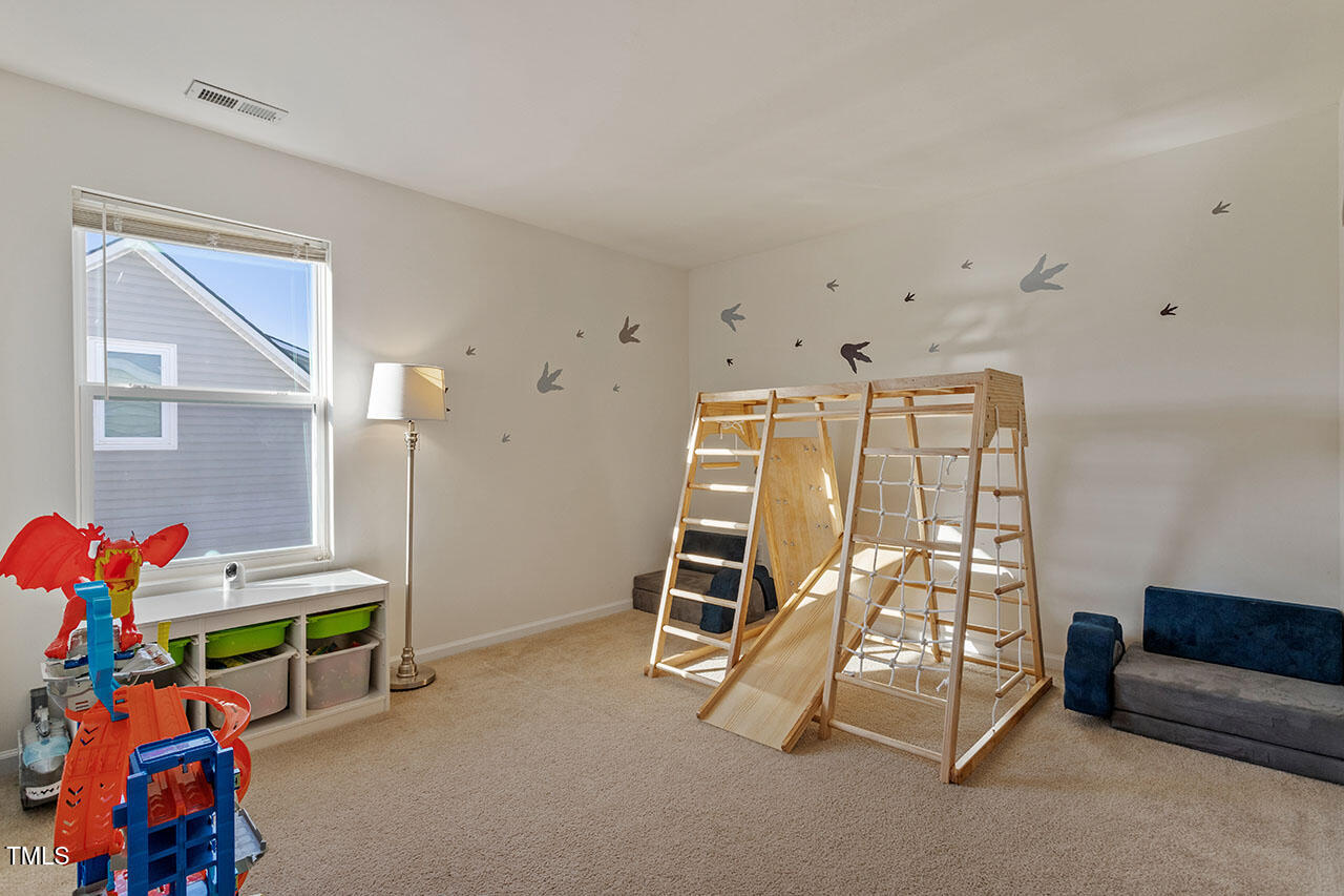 4817 Kitledge Drive Raleigh, NC 27610 - Photo 20 of 28 a bedroom with bunk beds and a window