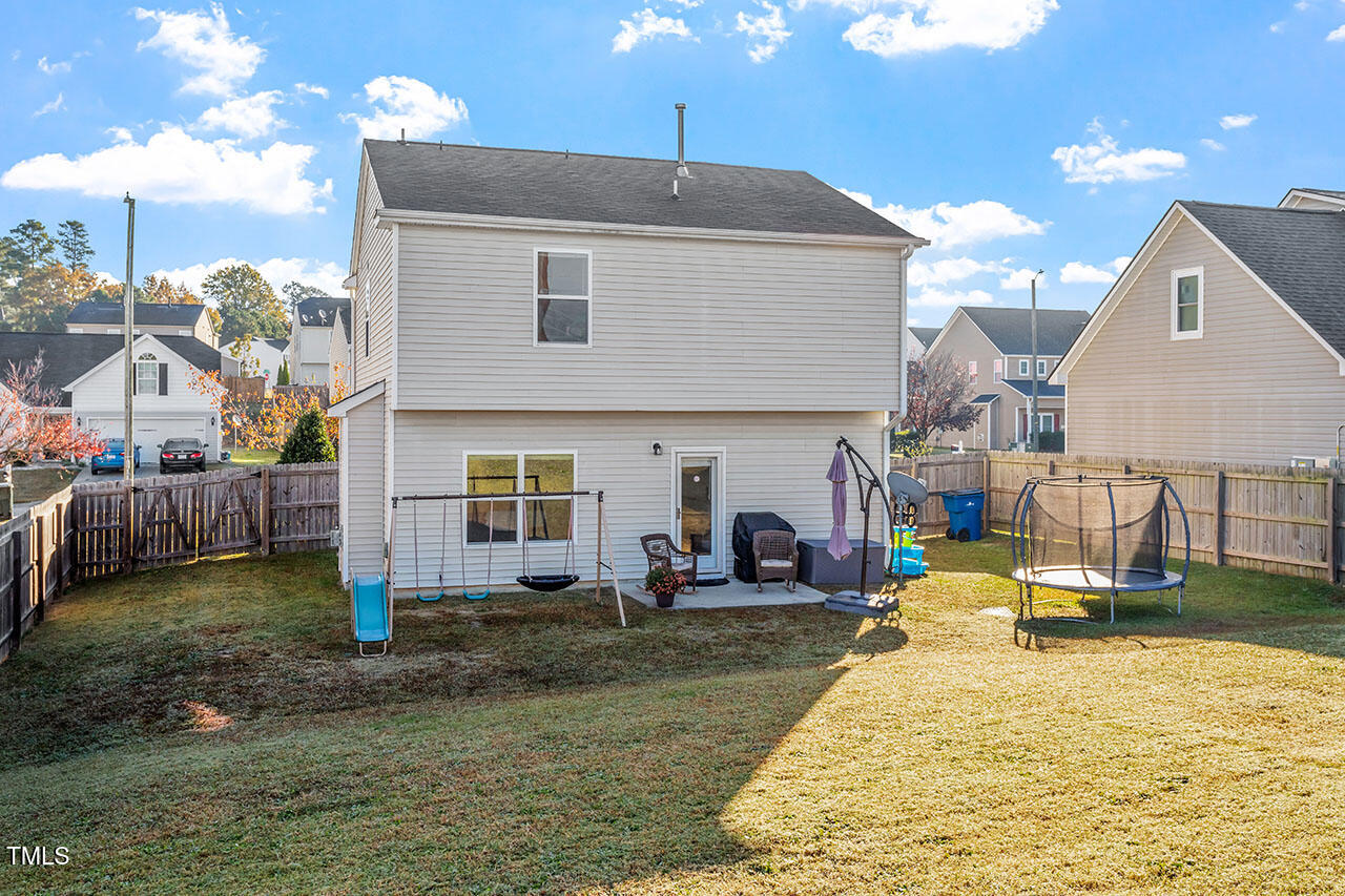 4817 Kitledge Drive Raleigh, NC 27610 - Photo 24 of 28 a view of a house with backyard and sitting area
