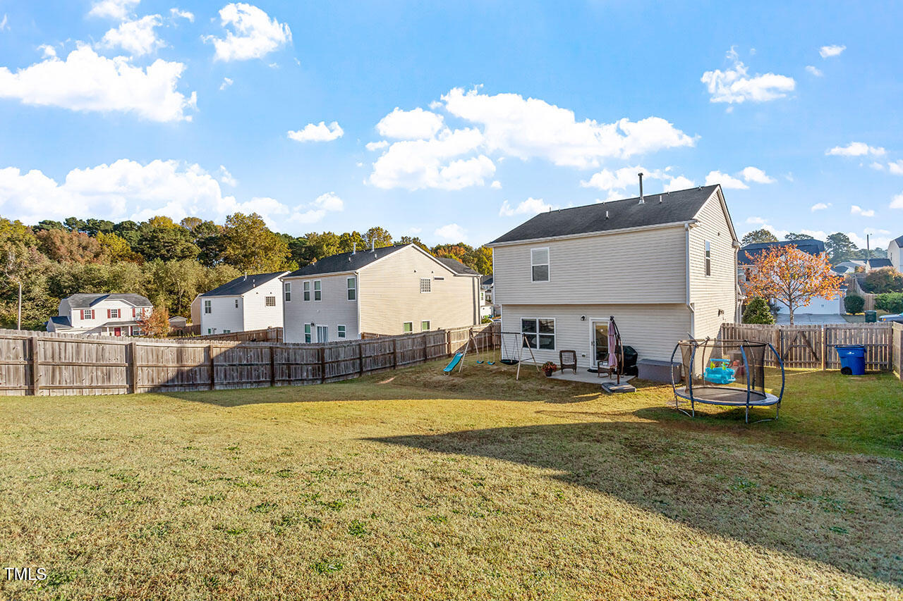 4817 Kitledge Drive Raleigh, NC 27610 - Photo 26 of 28 a view of a house with swimming pool and sitting area