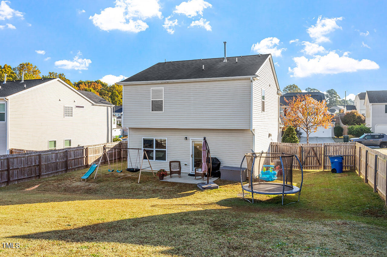4817 Kitledge Drive Raleigh, NC 27610 - Photo 27 of 28 a view of a swimming pool with a lounge chairs