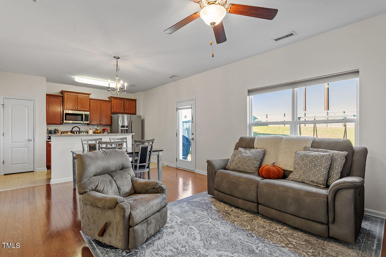 4817 Kitledge Drive Raleigh, NC 27610 - Photo 7 of 28 a living room with furniture and kitchen view