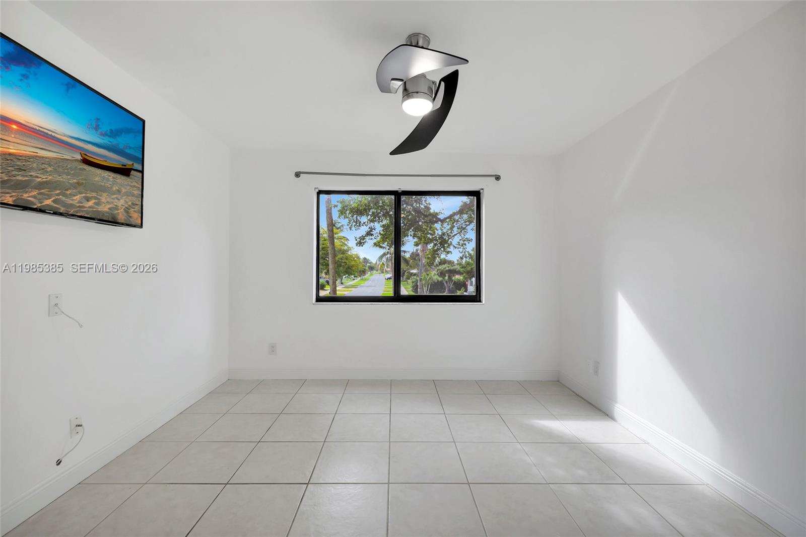 a view of an empty room with a window