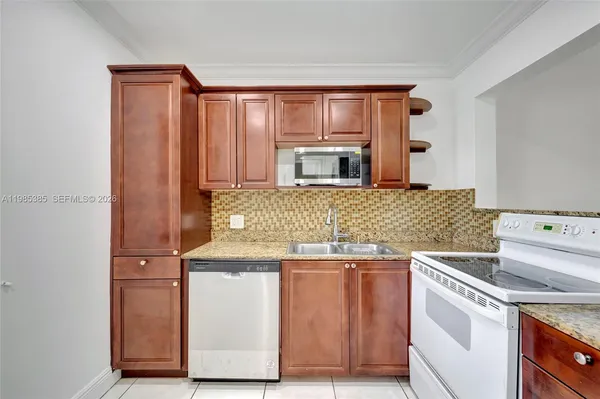 a view of a livingroom with an empty space and a window