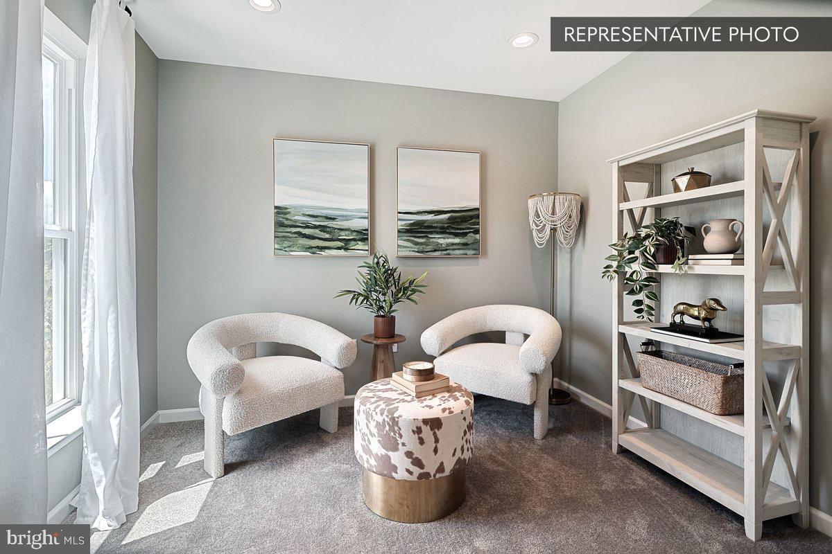 Sweet Birch Plan At Seiders Hill Pottsville, PA 17901 - Photo 4 of 15 a living room with furniture and a window