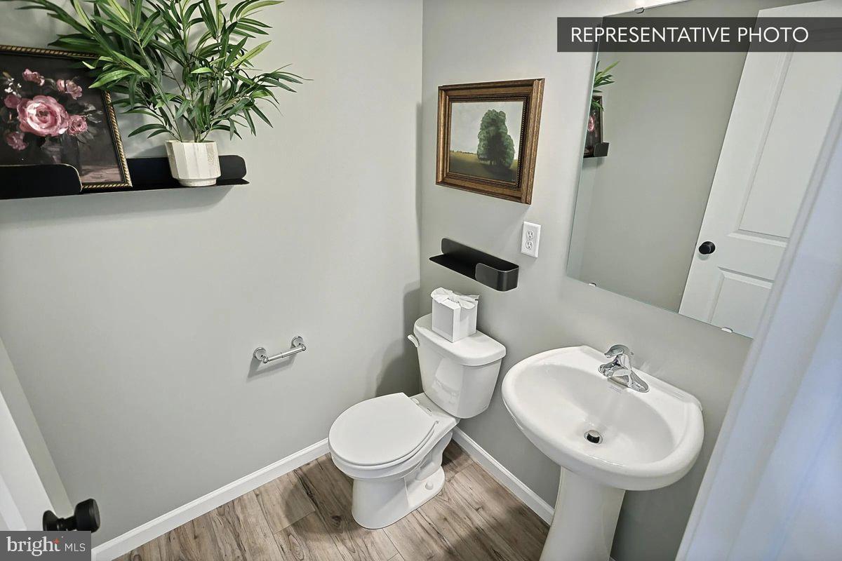 Sweet Birch Plan At Seiders Hill Pottsville, PA 17901 - Photo 5 of 15 a bathroom with a sink a toilet and a mirror