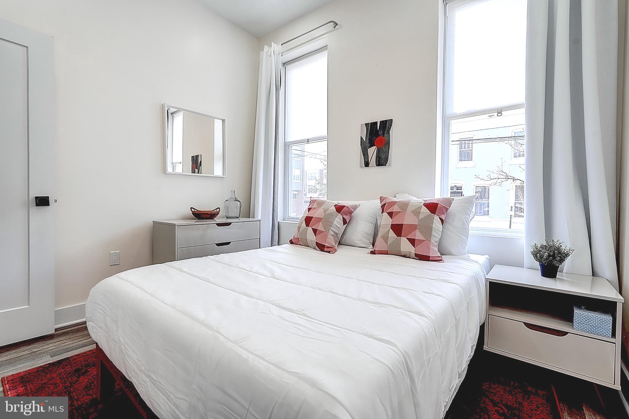 2203 Catharine Street Philadelphia, PA 19146 - Photo 14 of 27 a bedroom with a bed and a window