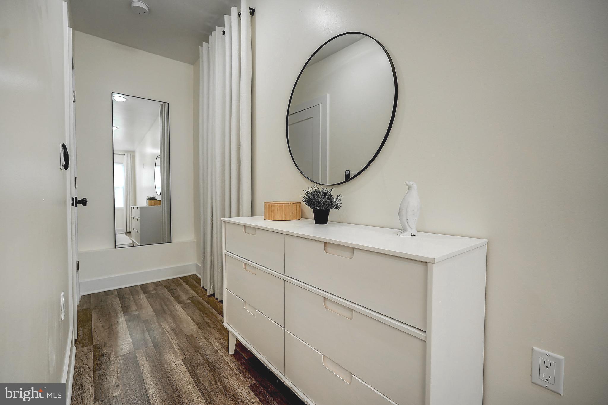 2203 Catharine Street Philadelphia, PA 19146 - Photo 18 of 27 a bathroom with a sink and a mirror